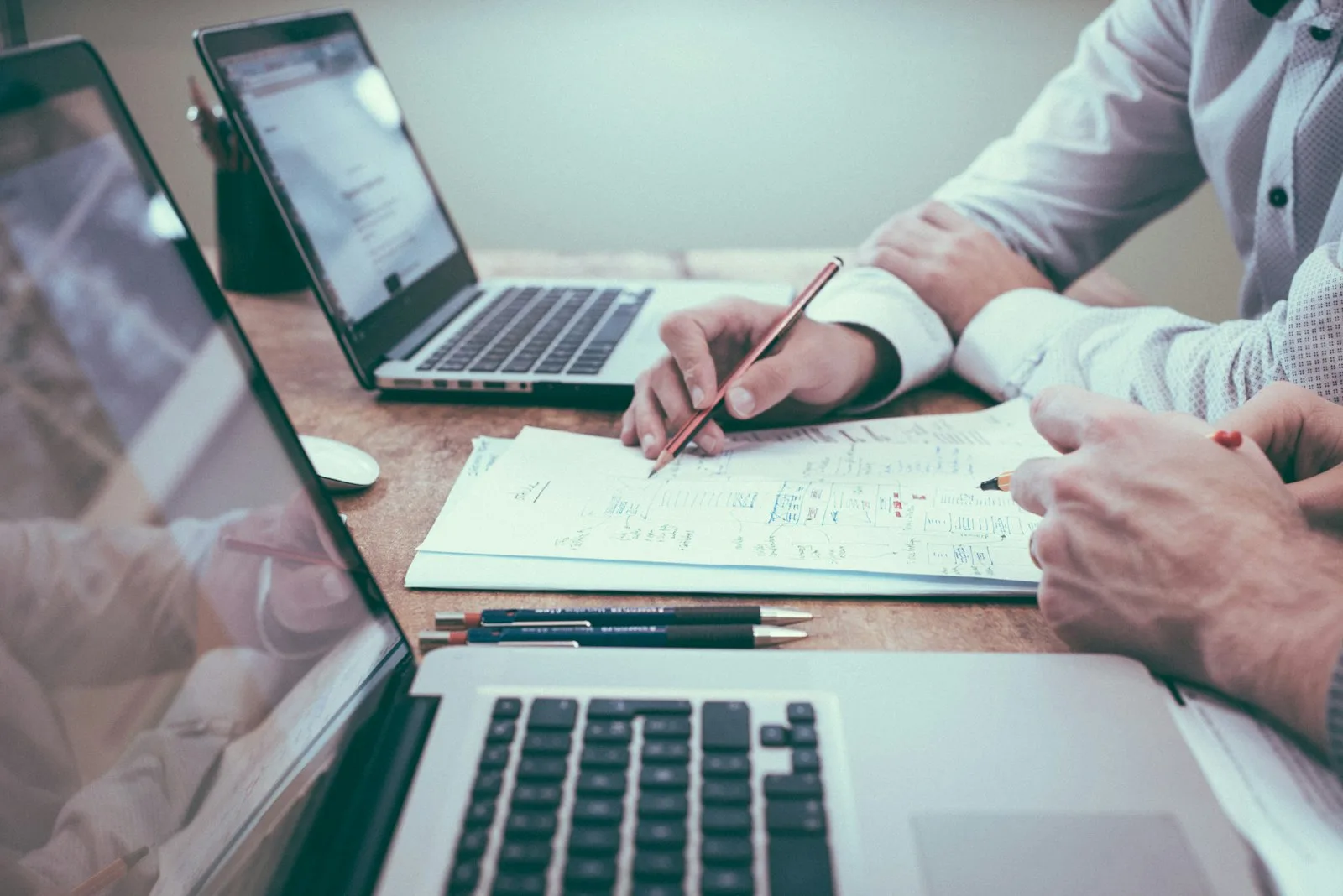 Two professionals reviewing legal documents during a consultation